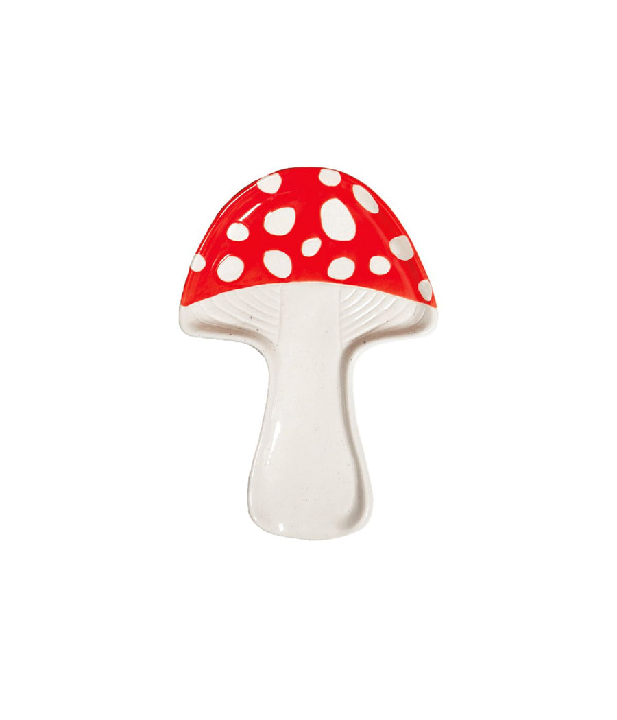 Un portacucchiaio a forma di fungo rosso a pois bianchi su uno sfondo bianco